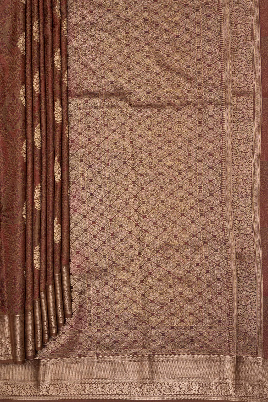 Pleats and pallu of Brown Kanchipuram Silk Saree with Printed design on the body and Zari Border. 