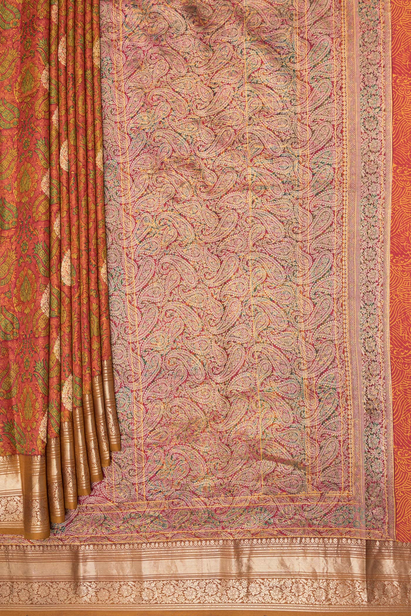 Pleats and pallu of Orange Kanchipuram Silk Saree with Printed design on the body and Zari Border. 