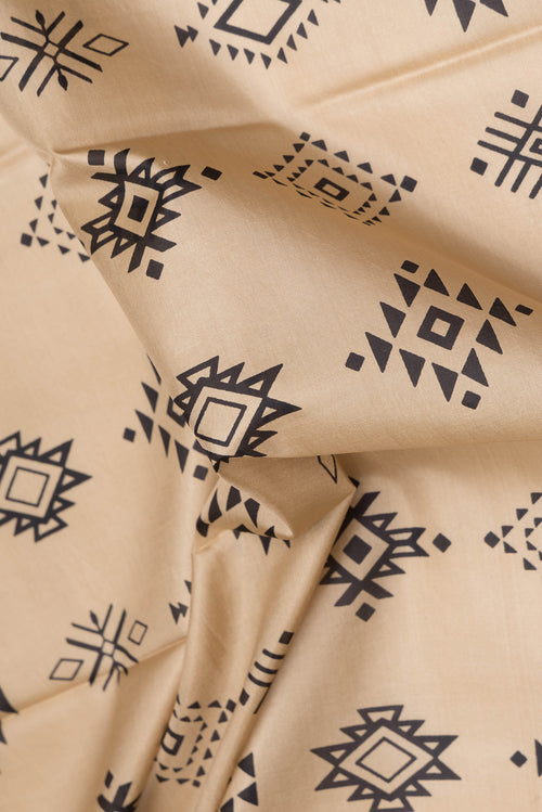 Close up of Beige Dual Tone Kanjivaram Silk Saree with Printed design on the body and Thread Border.  displaying folds