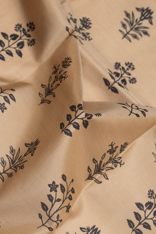 Close up of Beige Dual Tone Kanjivaram Silk Saree with Printed design on the body and Thread Border.  displaying folds