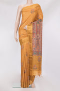 Mustard Tussar Silk Saree with Embroidery on the body and Zari Border.  displayed on a mannequin