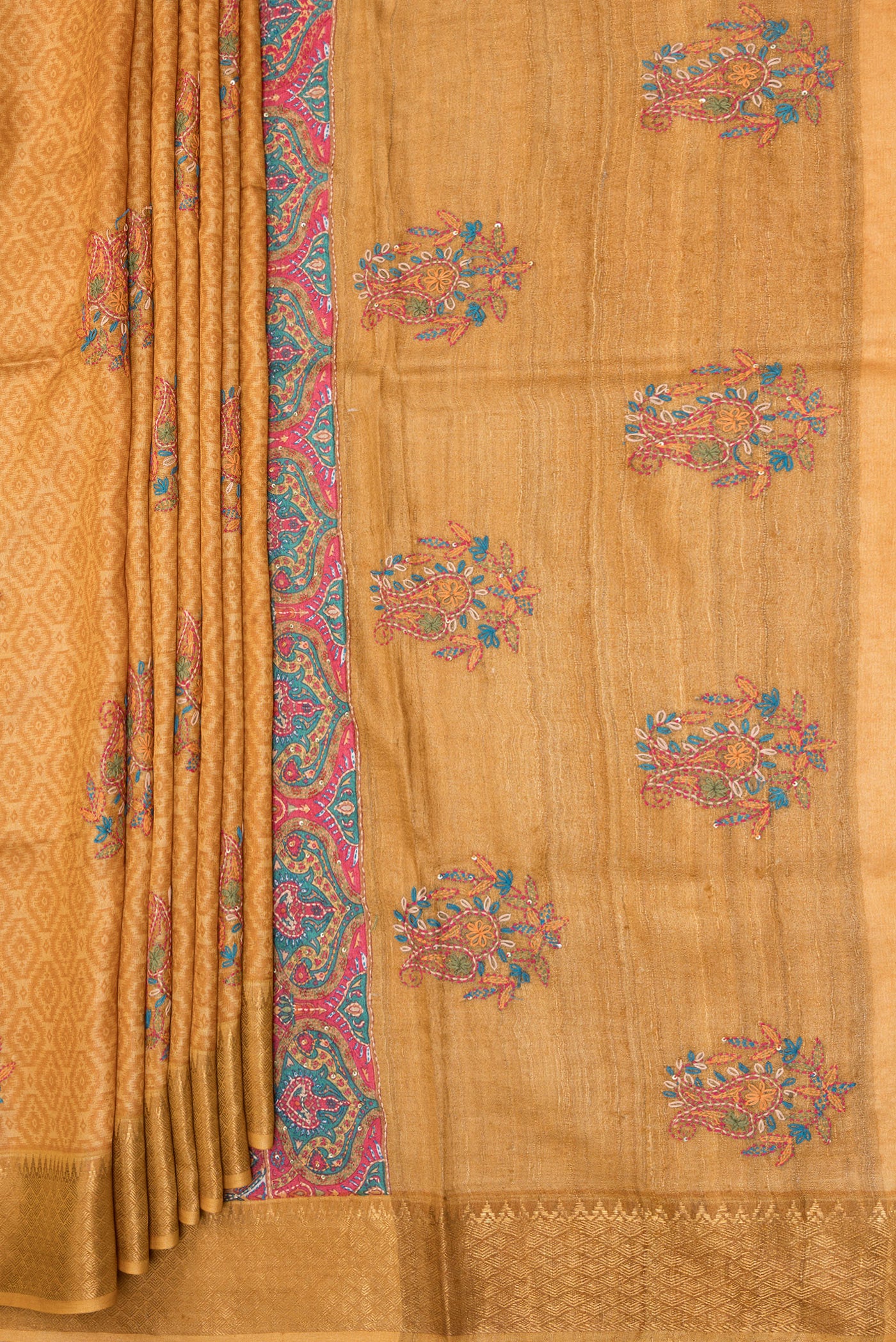 Pleats and pallu of Mustard Tussar Silk Saree with Embroidery on the body and Zari Border. 