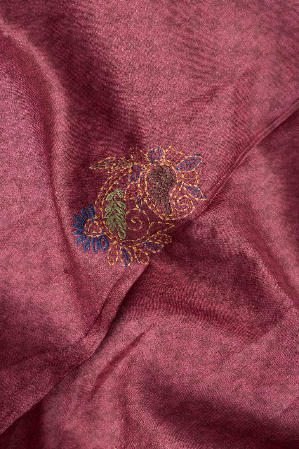 Close up of Peacock Blue Dual Tone Tussar Silk Saree with Printed design on the body and Embroidery Border.  displaying folds