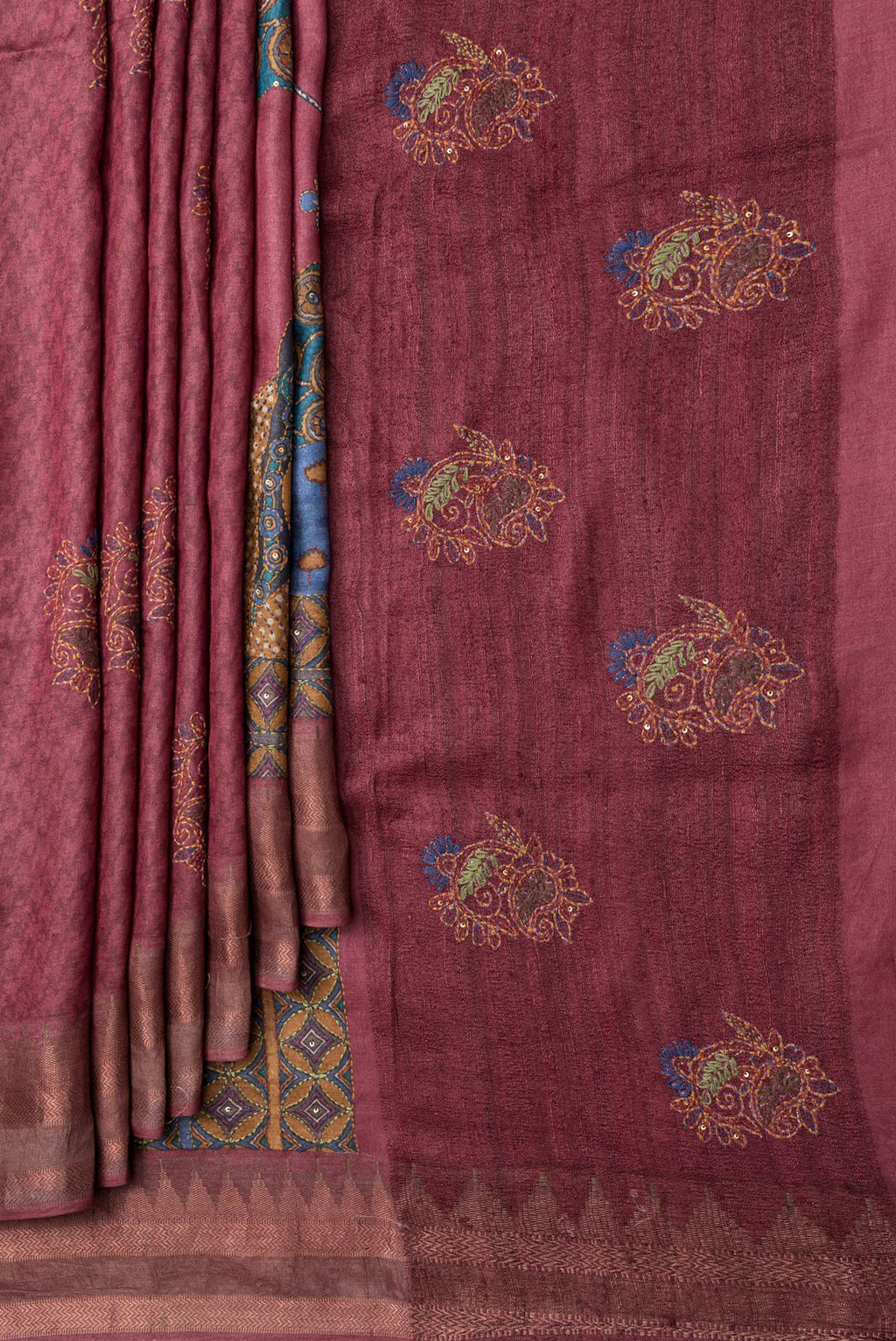 Pleats and pallu of Peacock Blue Dual Tone Tussar Silk Saree with Printed design on the body and Embroidery Border. 