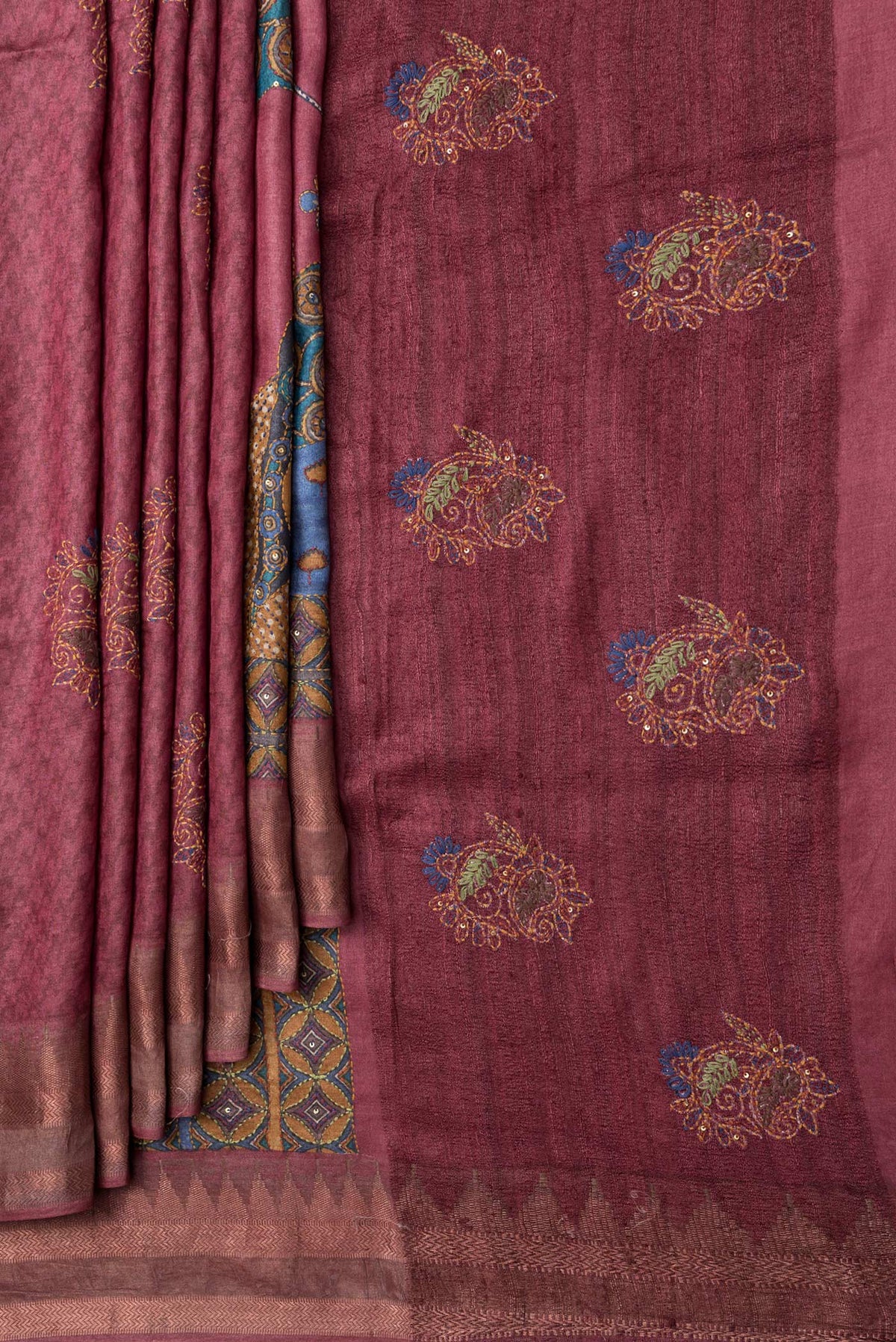 Pleats and pallu of Peacock Blue Dual Tone Tussar Silk Saree with Printed design on the body and Embroidery Border. 