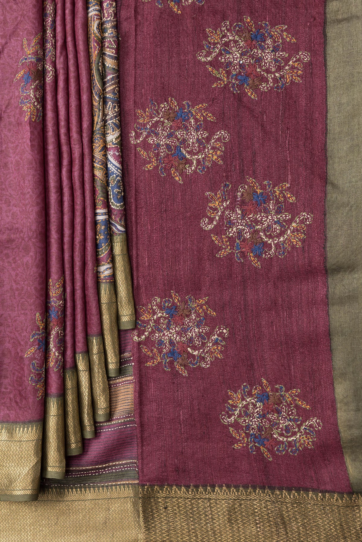 Pleats and pallu of Magenta Dual Tone Tussar Silk Saree with Embroidery on the body and Zari Border. 