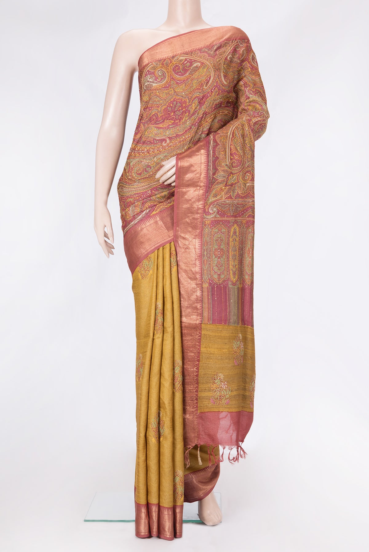 Mustard Dual Tone Tussar Silk Saree with Embroidery on the body and Zari Border.  displayed on a mannequin