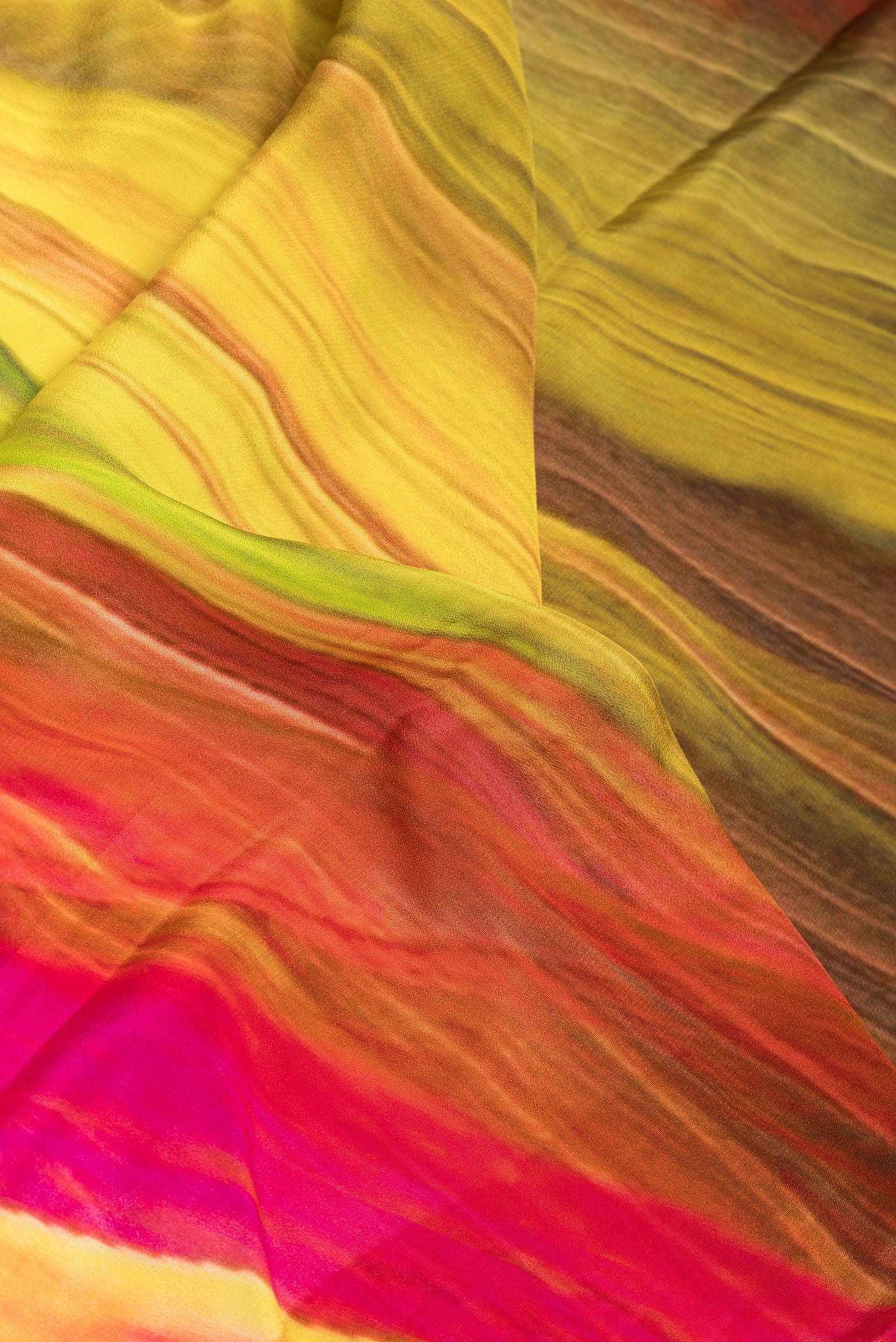 Close up of Multi Color Crepe Saree with Printed design on the body and Plain Border.  displaying folds