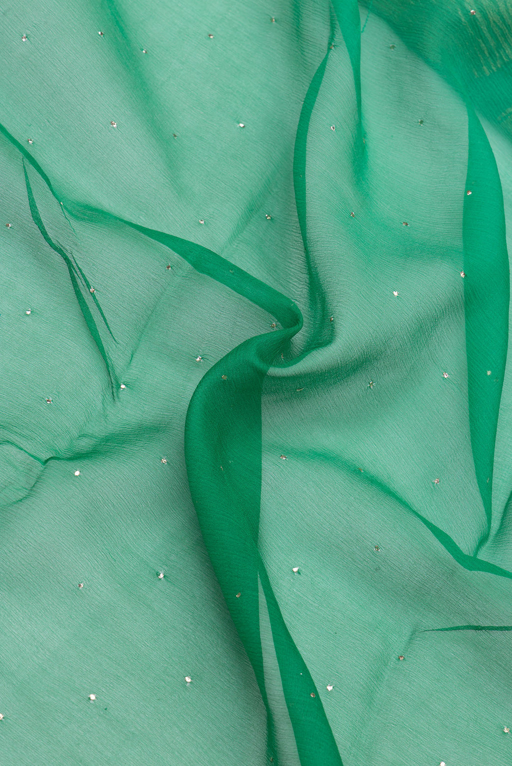 Close up of Green Mysore Chiffon Saree with Embroidery on the body and Zari Border.  displaying folds
