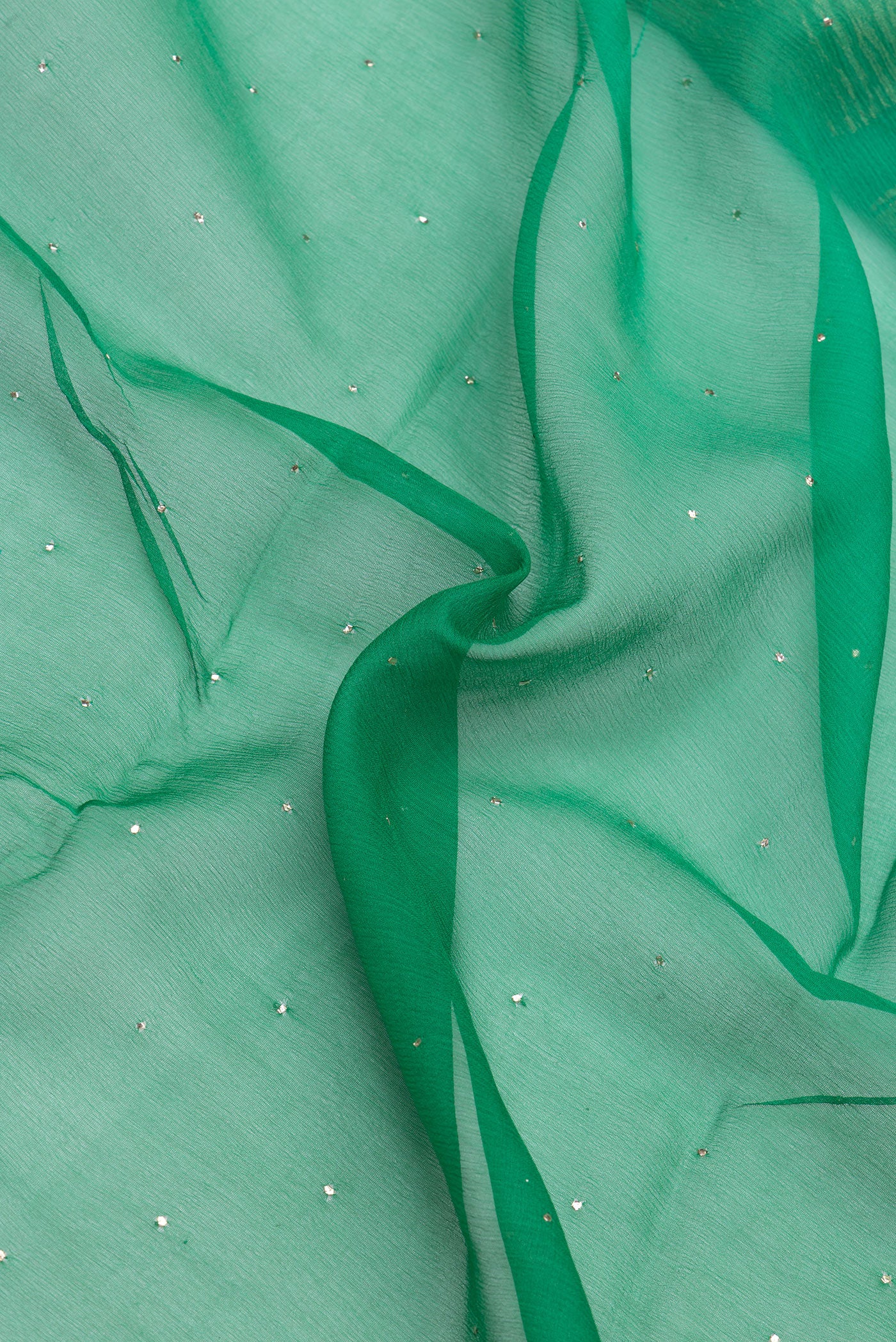 Close up of Green Mysore Chiffon Saree with Embroidery on the body and Zari Border.  displaying folds