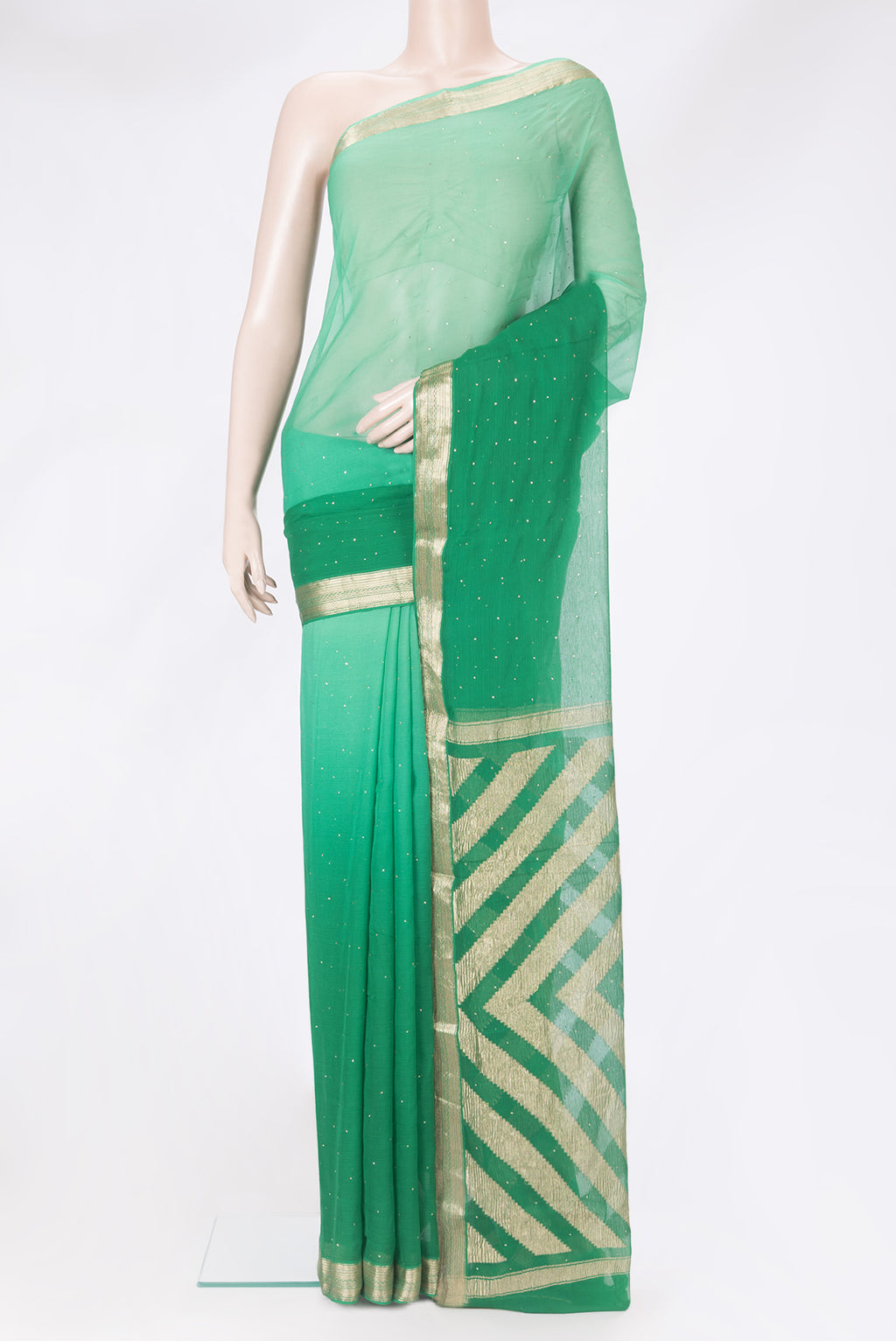 Green Mysore Chiffon Saree with Embroidery on the body and Zari Border.  displayed on a mannequin