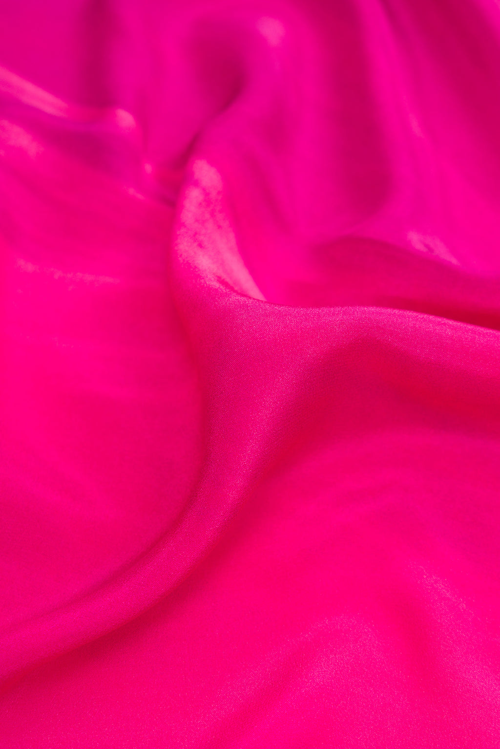 Close up of Pink Dual Tone Mysore Crepe Saree with Printed design on the body and Plain Border.  displaying folds