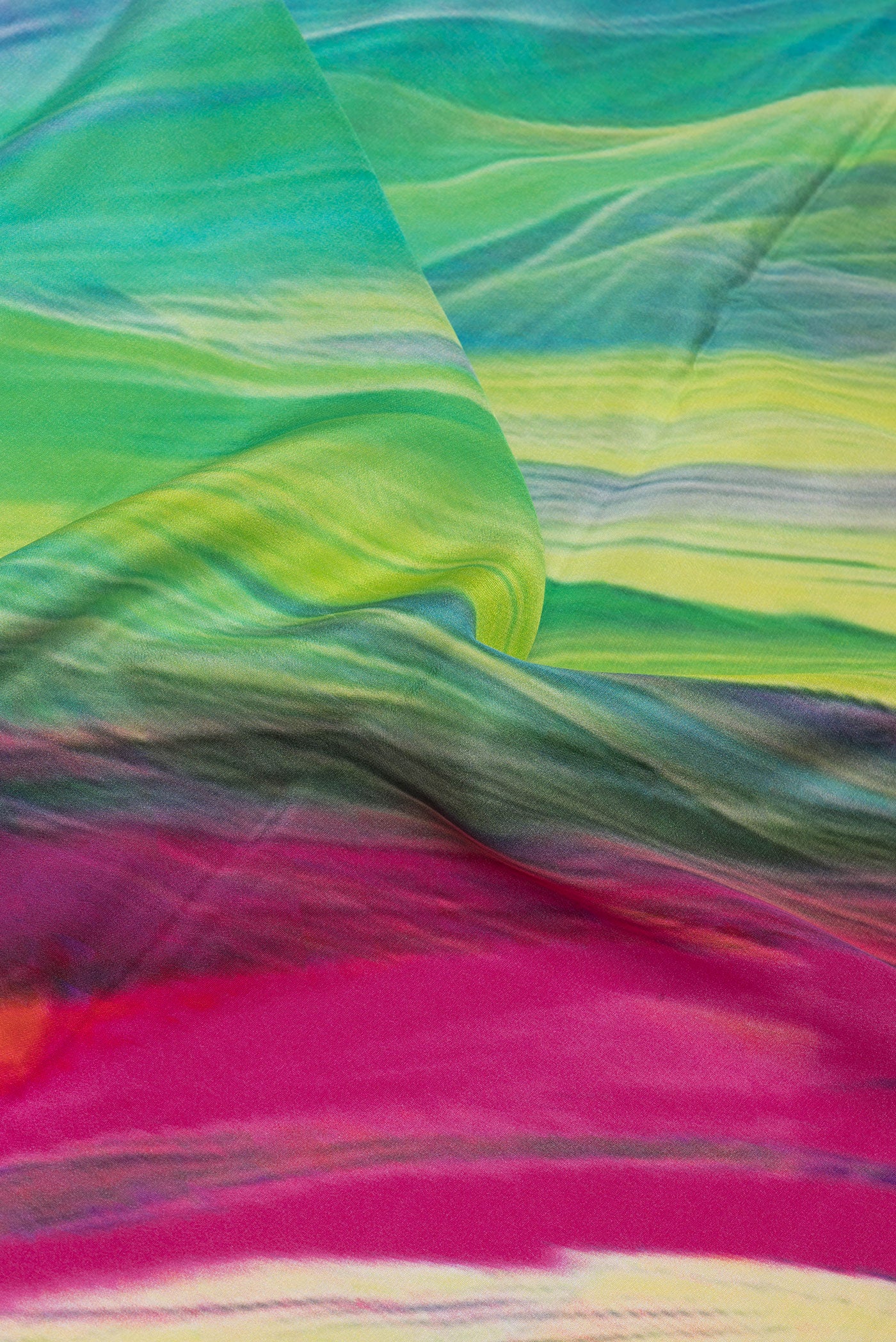 Close up of Multi Color Crepe Saree with Printed design on the body and Plain Border.  displaying folds