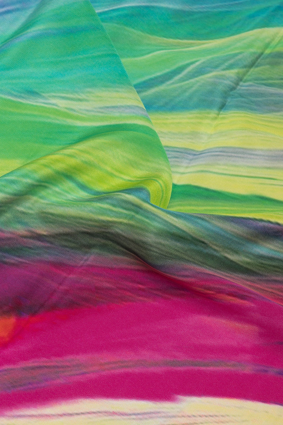 Close up of Multi Color Crepe Saree with Printed design on the body and Plain Border.  displaying folds