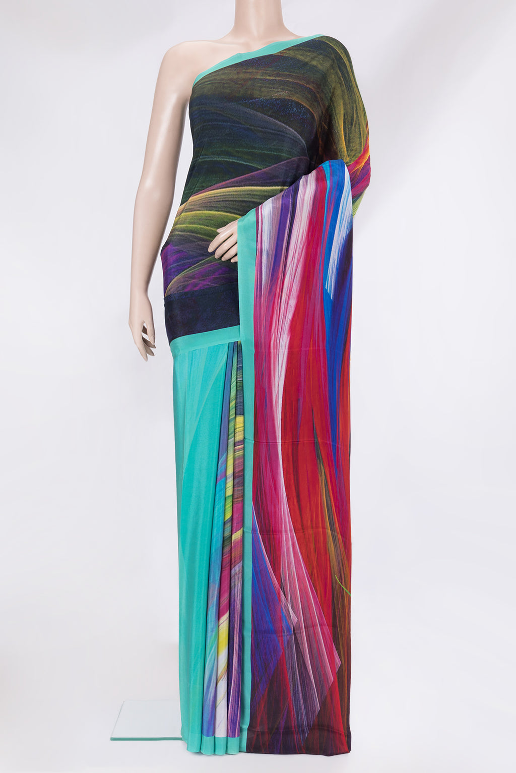 Multi Color Crepe Saree with Printed design on the body and Plain Border.  displayed on a mannequin