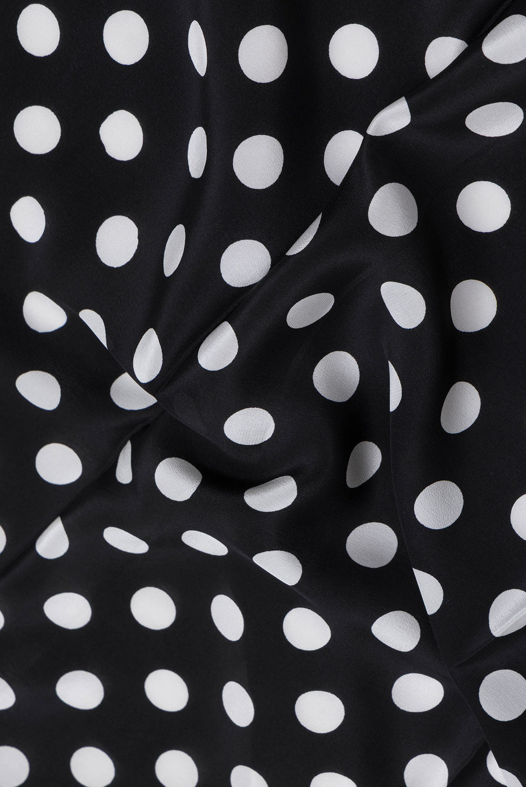 Close up of Black Dual Tone Mysore Crepe Saree with Printed design on the body and Without Border.  displaying folds