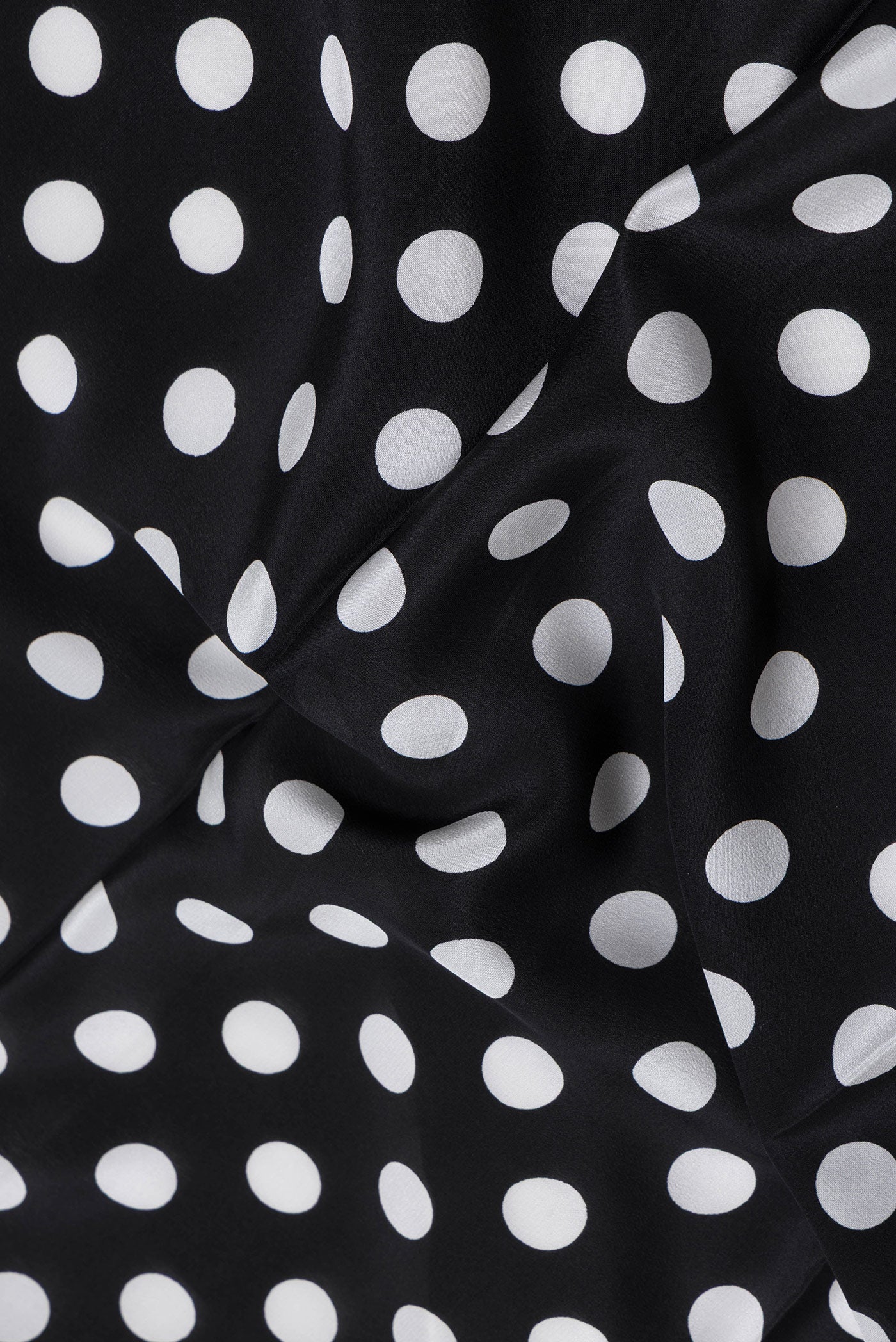 Close up of Black Dual Tone Mysore Crepe Saree with Printed design on the body and Without Border.  displaying folds