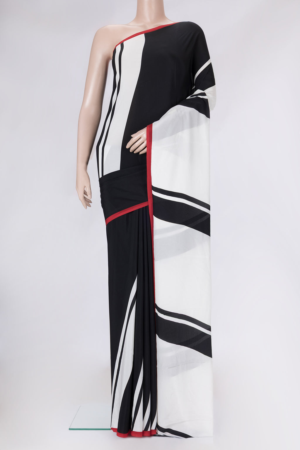 Black Dual Tone Mysore Crepe Saree with Printed design on the body and Plain Border.  displayed on a mannequin