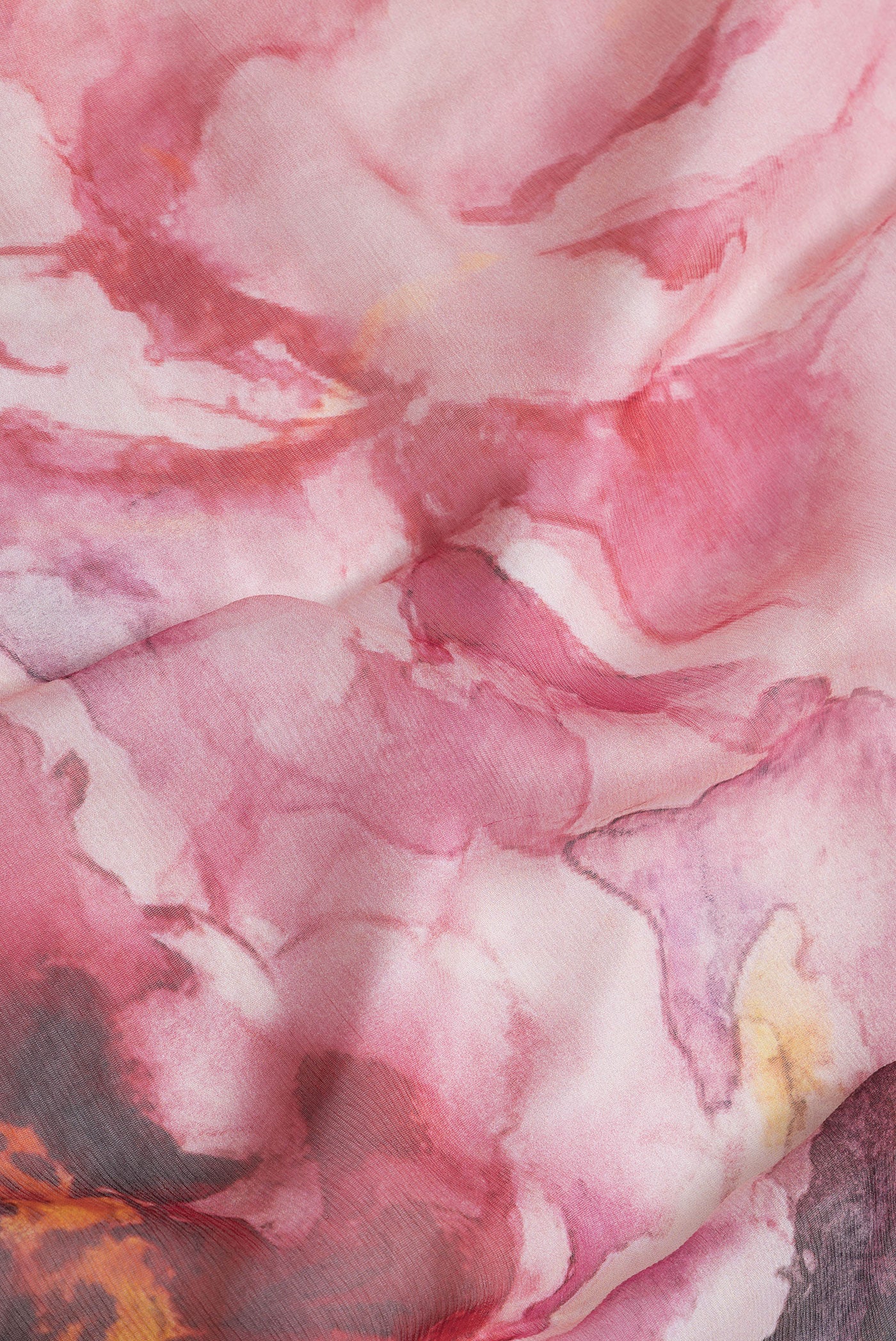 Close up of Pink Dual Tone Mysore Chiffon Saree with Printed design on the body and Without Border.  displaying folds