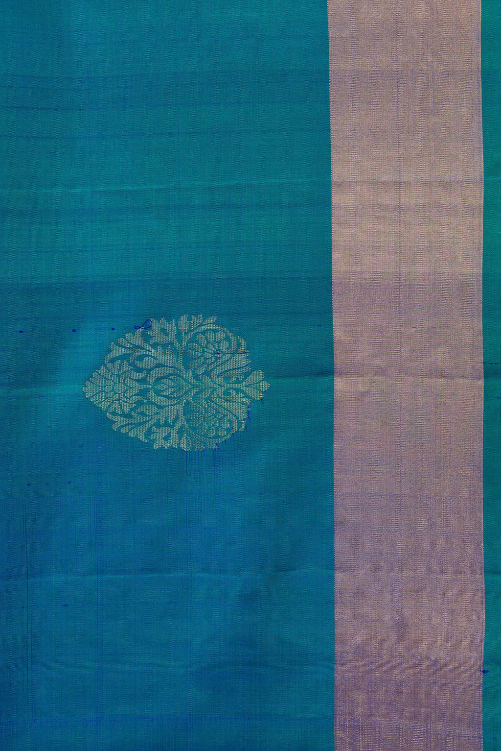 Border image of Peacock Blue Dual Tone Soft Silk Saree with Zari Butta on the body and Zari Border. 