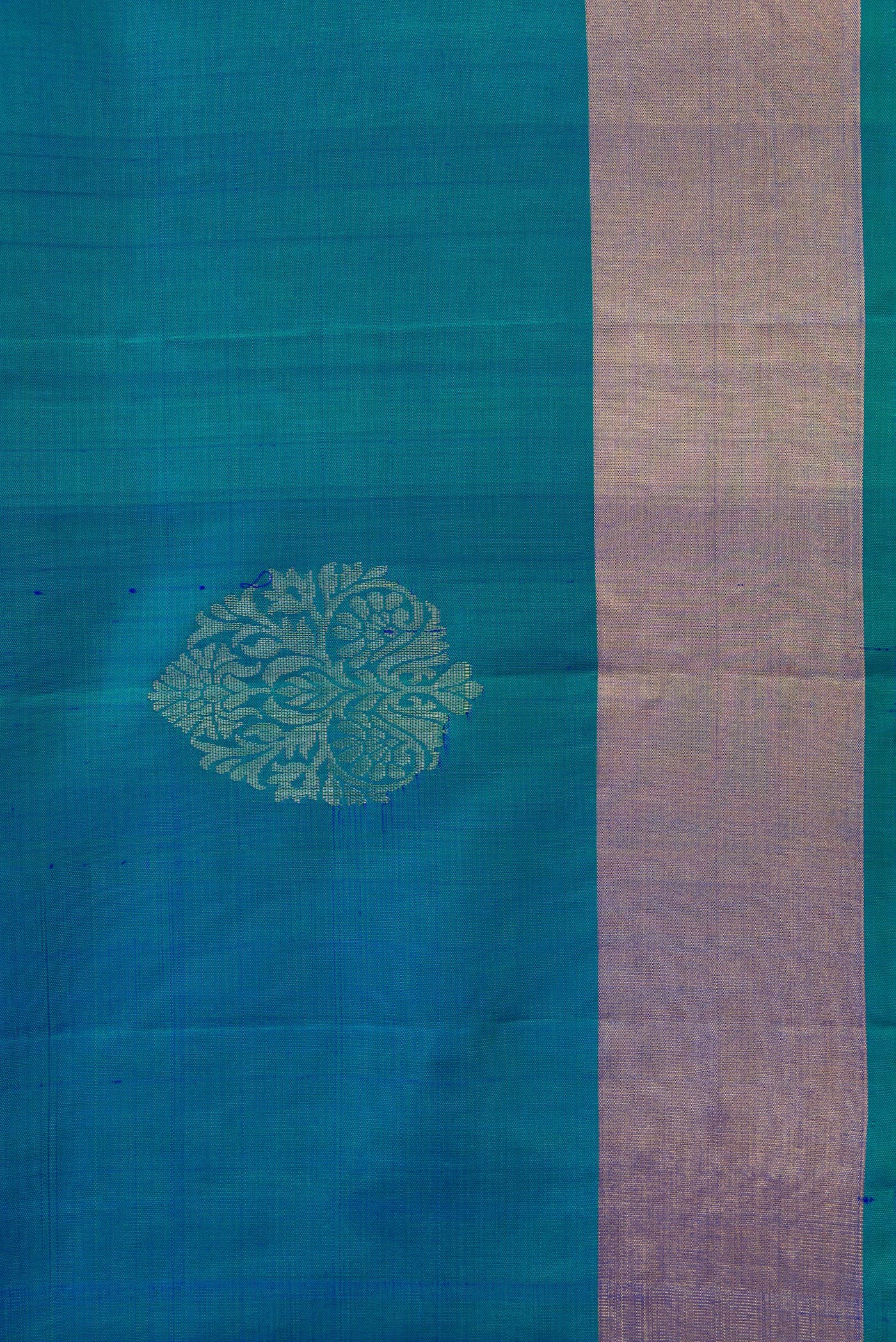 Border image of Peacock Blue Dual Tone Soft Silk Saree with Zari Butta on the body and Zari Border. 