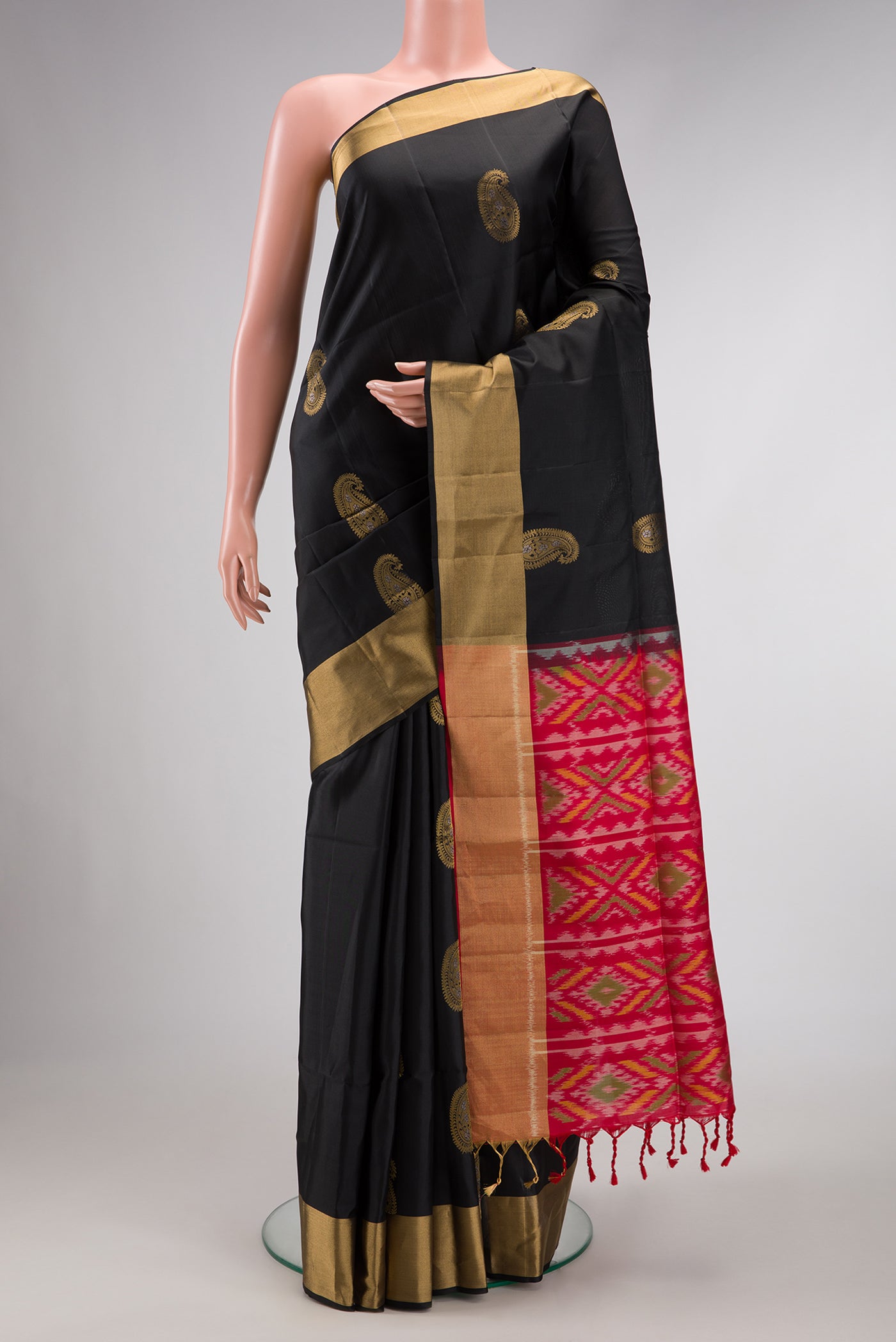 Black Dual Tone Soft Silk Saree with Zari Butta on the body and Zari Border.  displayed on a mannequin