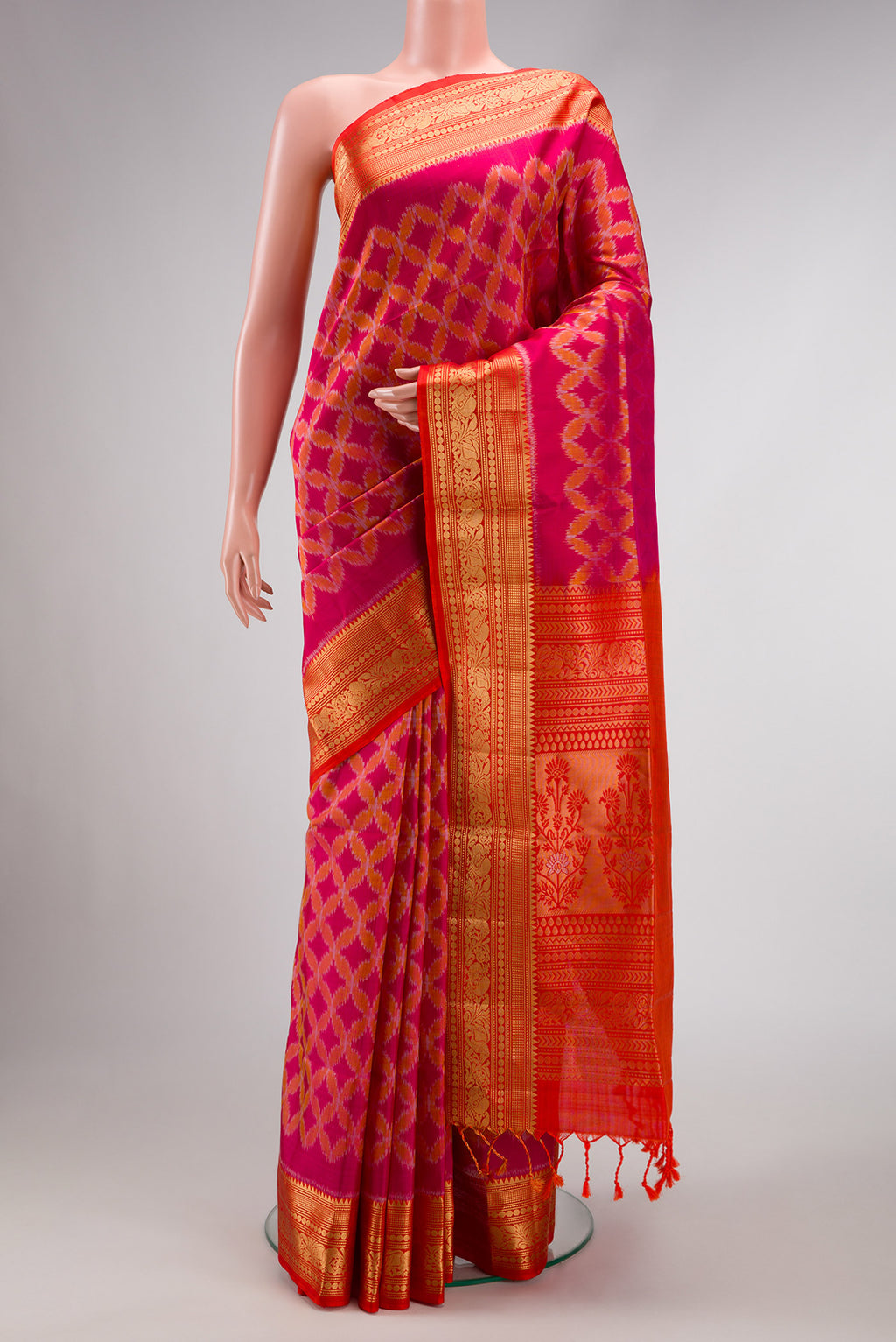 Dark Pink Dual Tone Soft Silk Saree with Ikat Print on the body and Zari Border.  displayed on a mannequin