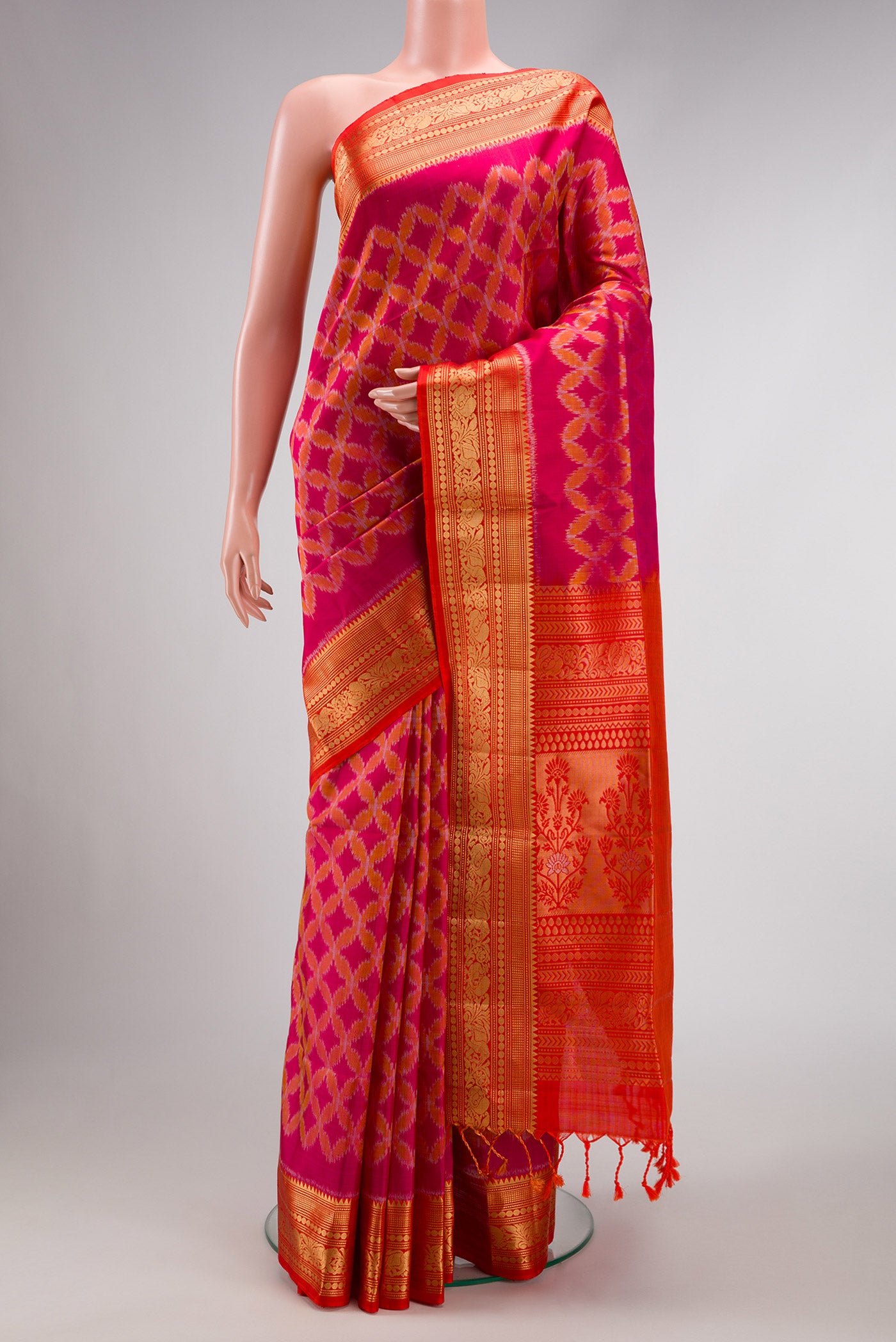 Dark Pink Dual Tone Soft Silk Saree with Ikat Print on the body and Zari Border.  displayed on a mannequin