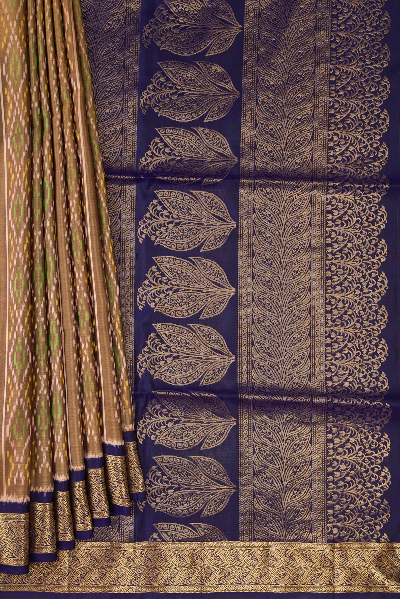 Pleats and pallu of Dark Beige Soft Silk Saree with Ikat design on the body and Zari Border. 