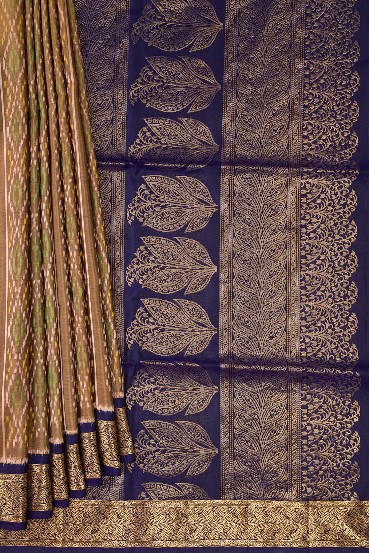 Pleats and pallu of Dark Beige Soft Silk Saree with Ikat design on the body and Zari Border. 