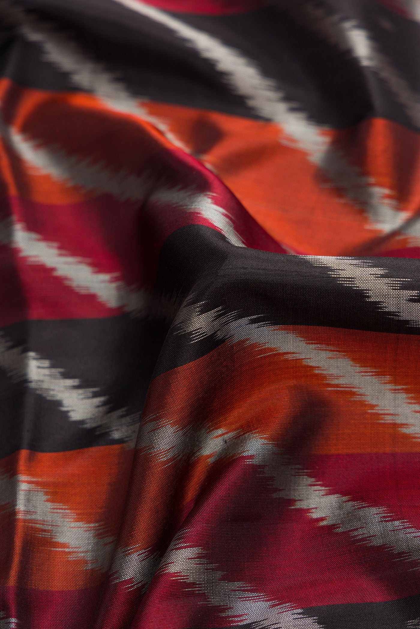 Close up of Black Dual Tone Soft Silk Saree with Stripes on the body and Zari Border.  displaying folds