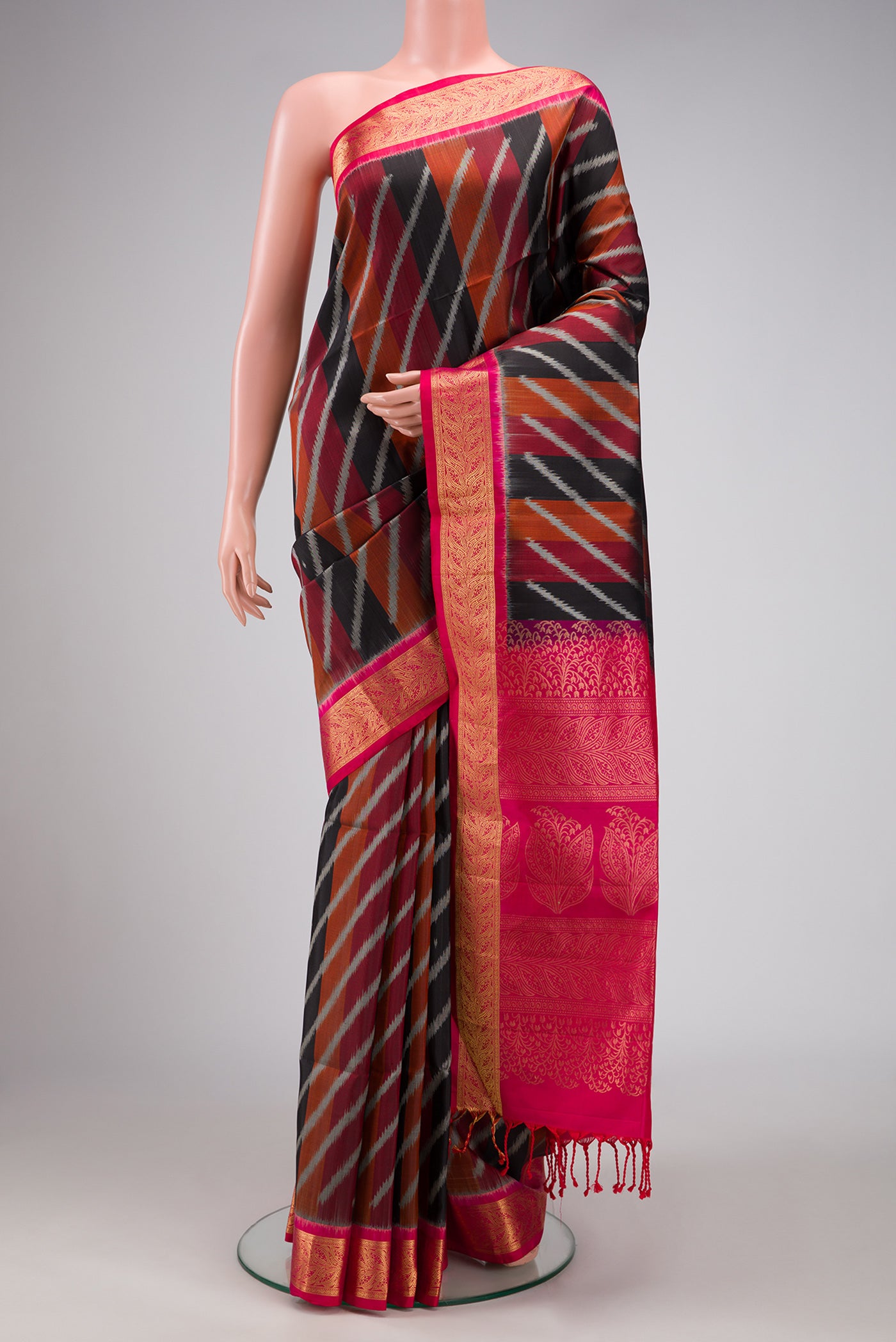 Black Dual Tone Soft Silk Saree with Stripes on the body and Zari Border.  displayed on a mannequin