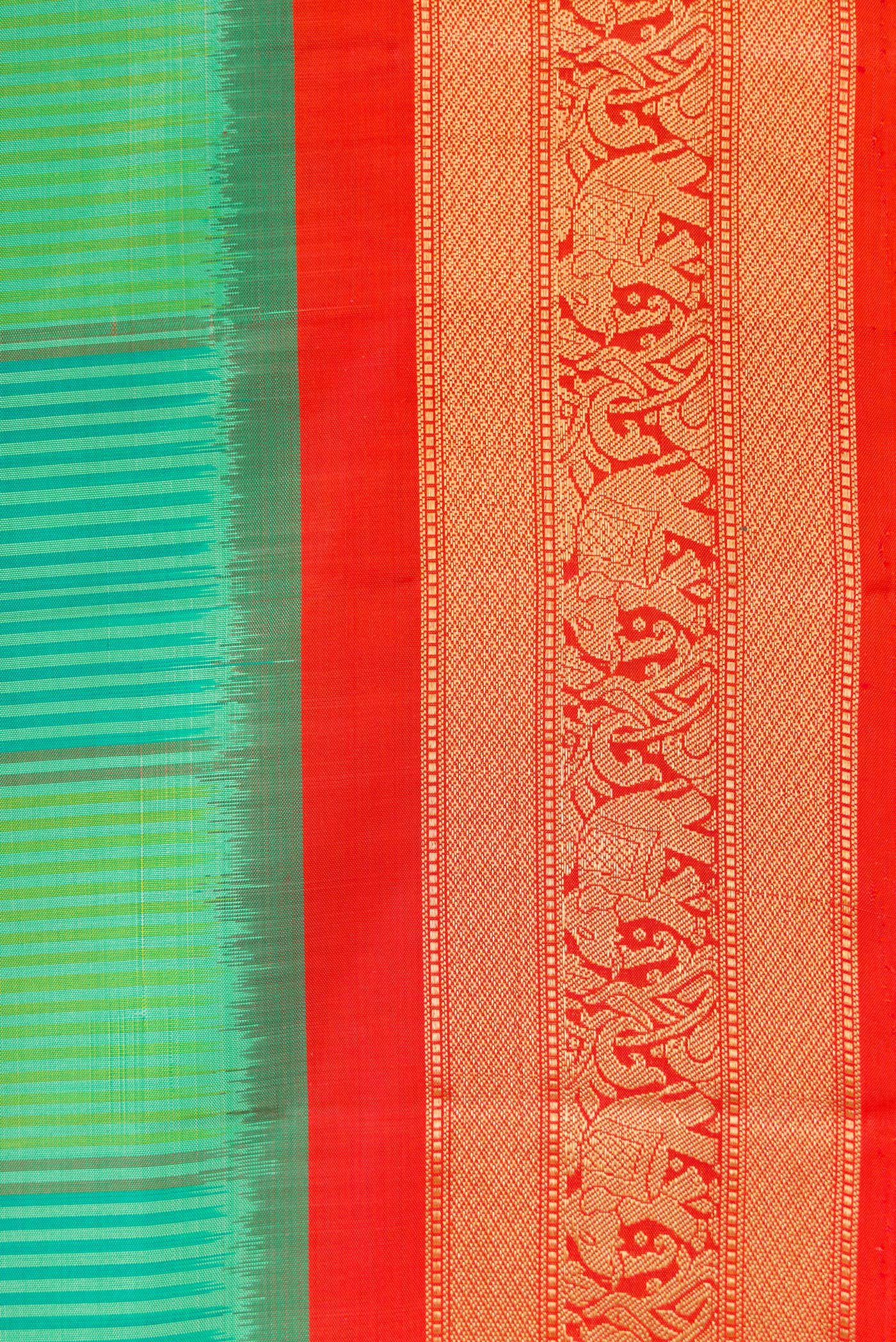 Border image of Green Dual Tone Soft Silk Saree with Ikat Print on the body and Zari Border. 
