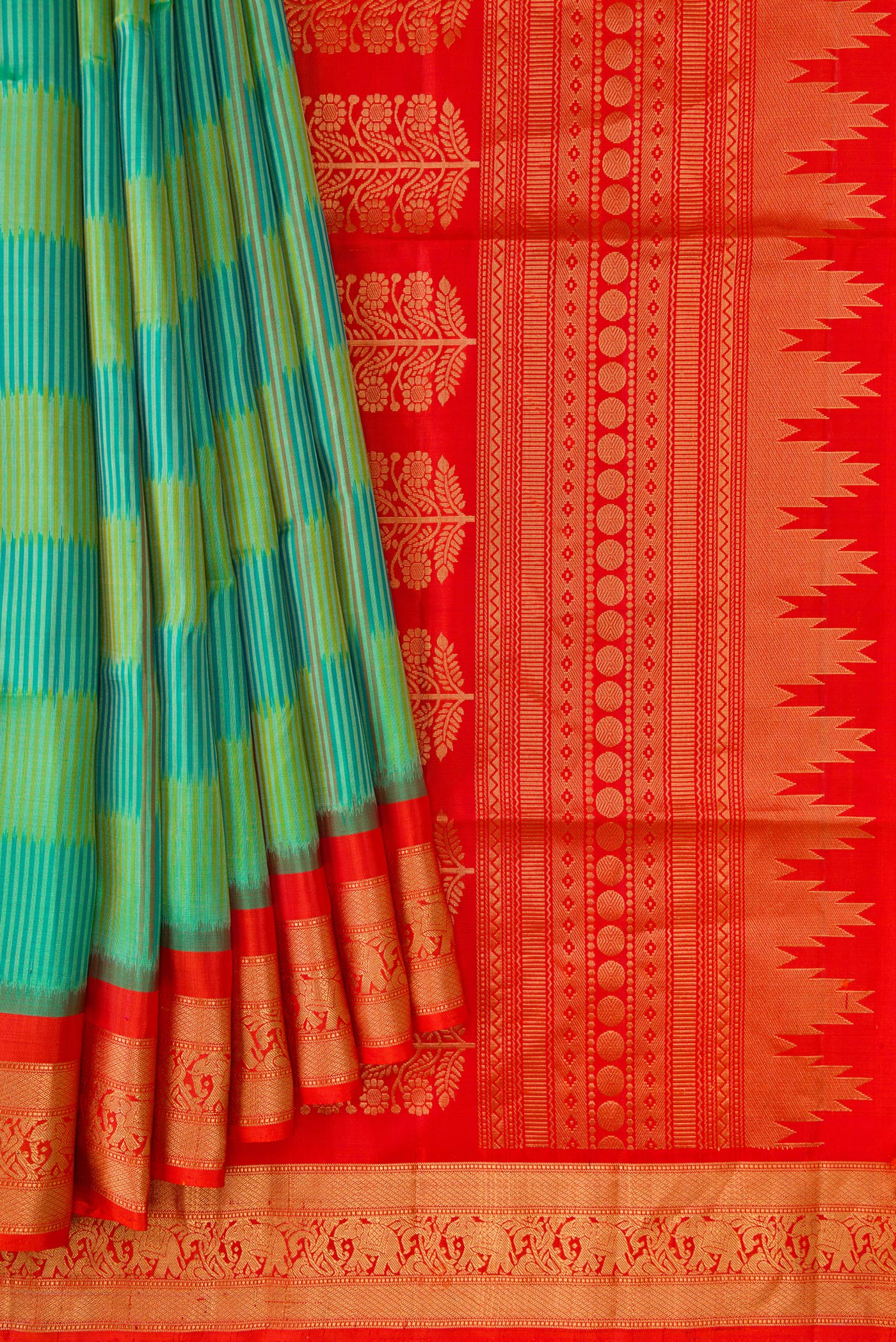 Pleats and pallu of Green Dual Tone Soft Silk Saree with Ikat Print on the body and Zari Border. 