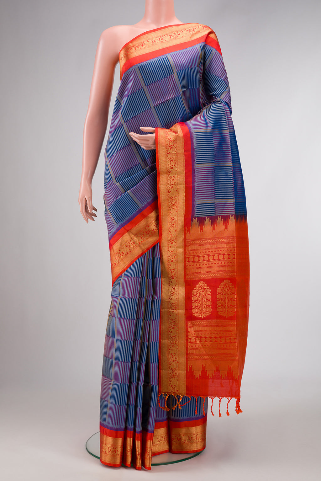 Royal Blue Dual Tone Soft Silk Saree with Checked design on the body and Zari Border.  displayed on a mannequin