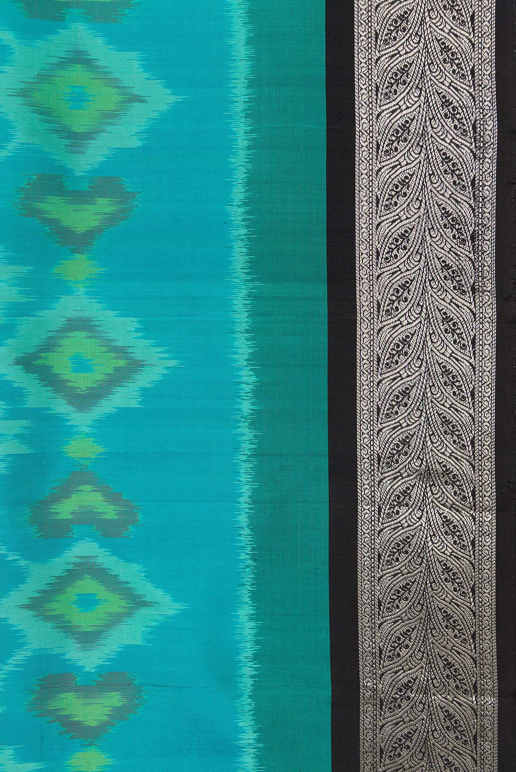 Border image of Sky Blue Dual Tone Soft Silk Saree with Ikat Print on the body and Zari Border. 