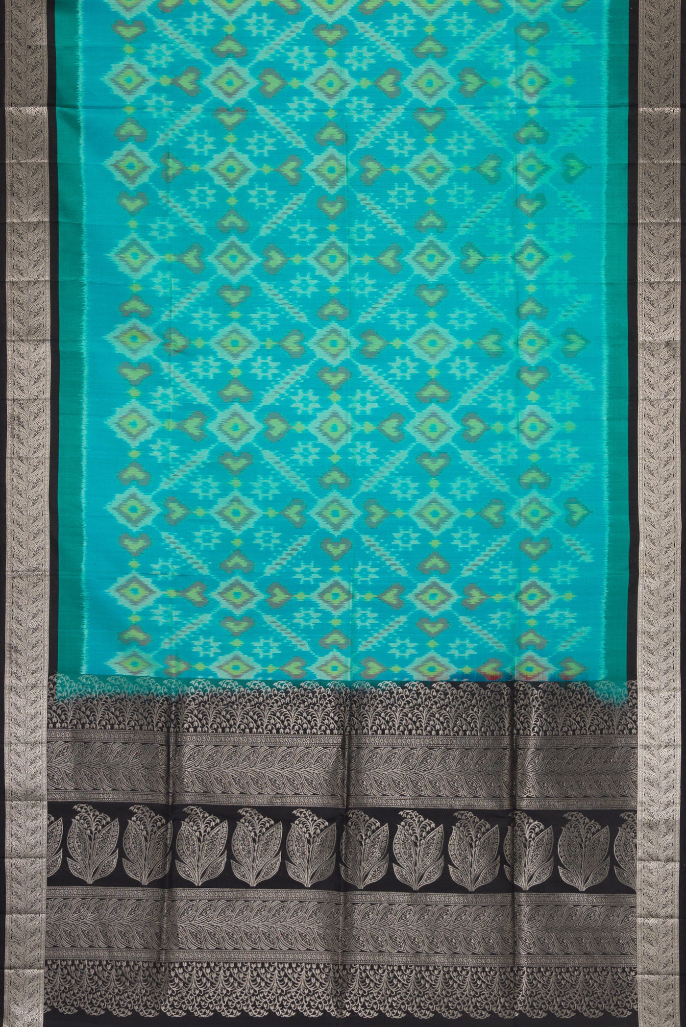 Flat view of Sky Blue Dual Tone Soft Silk Saree with Ikat Print on the body and Zari Border. 
