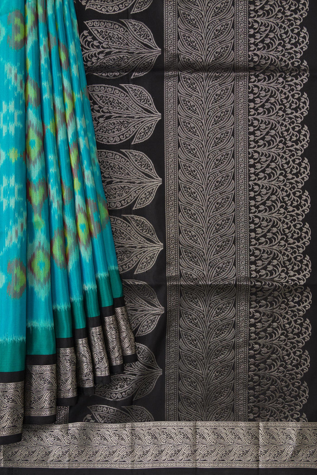Pleats and pallu of Sky Blue Dual Tone Soft Silk Saree with Ikat Print on the body and Zari Border. 