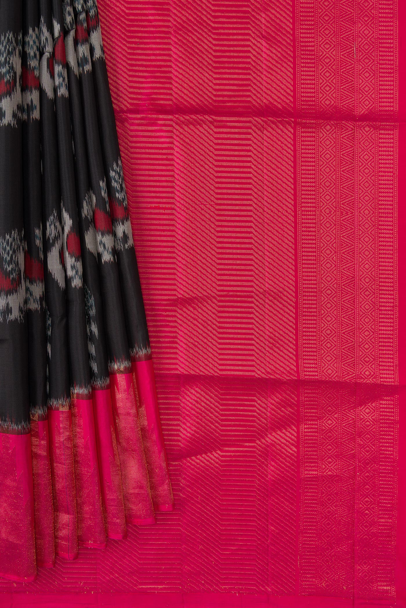 Pleats and pallu of Black Dual Tone Soft Silk Saree with Ikat Print on the body and Zari Border. 
