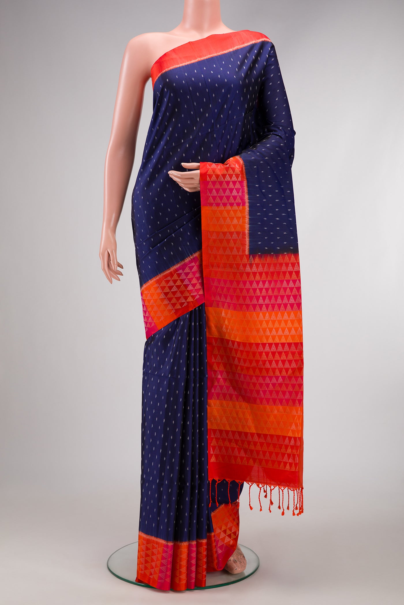 Navy Blue Dual Tone Soft Silk Saree with Ikat Print on the body and Fancy Border.  displayed on a mannequin