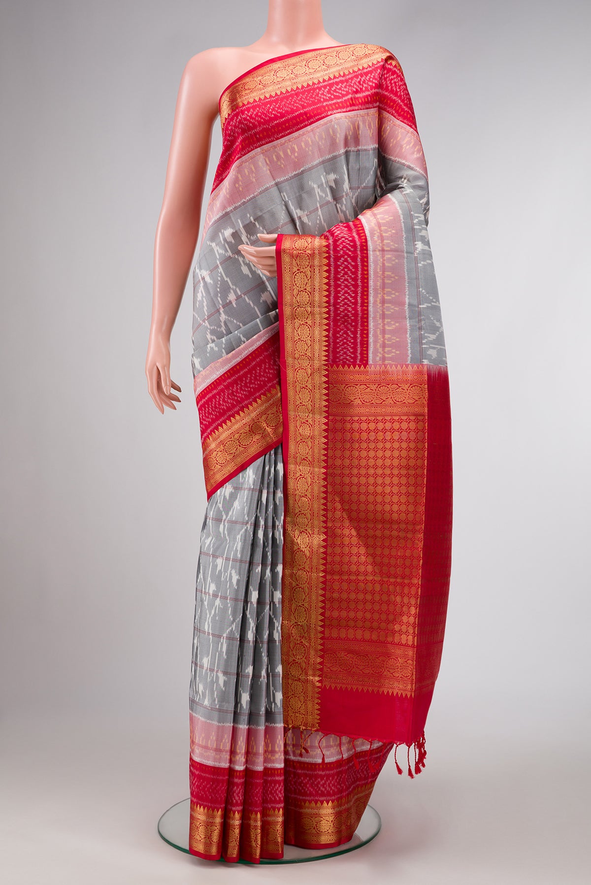 Grey Dual Tone Soft Silk Saree with Ikat Print on the body and Zari Border.  displayed on a mannequin