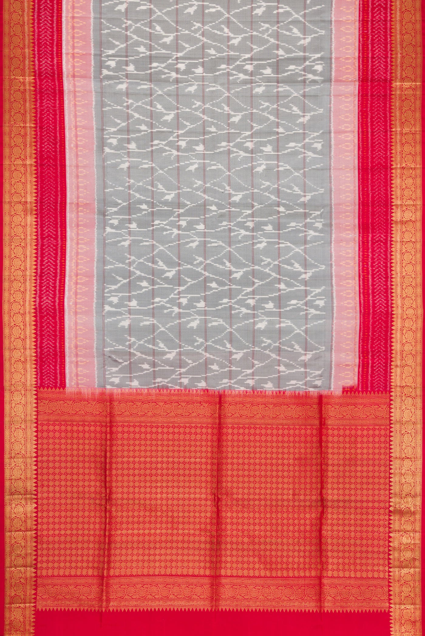 Flat view of Grey Dual Tone Soft Silk Saree with Ikat Print on the body and Zari Border. 