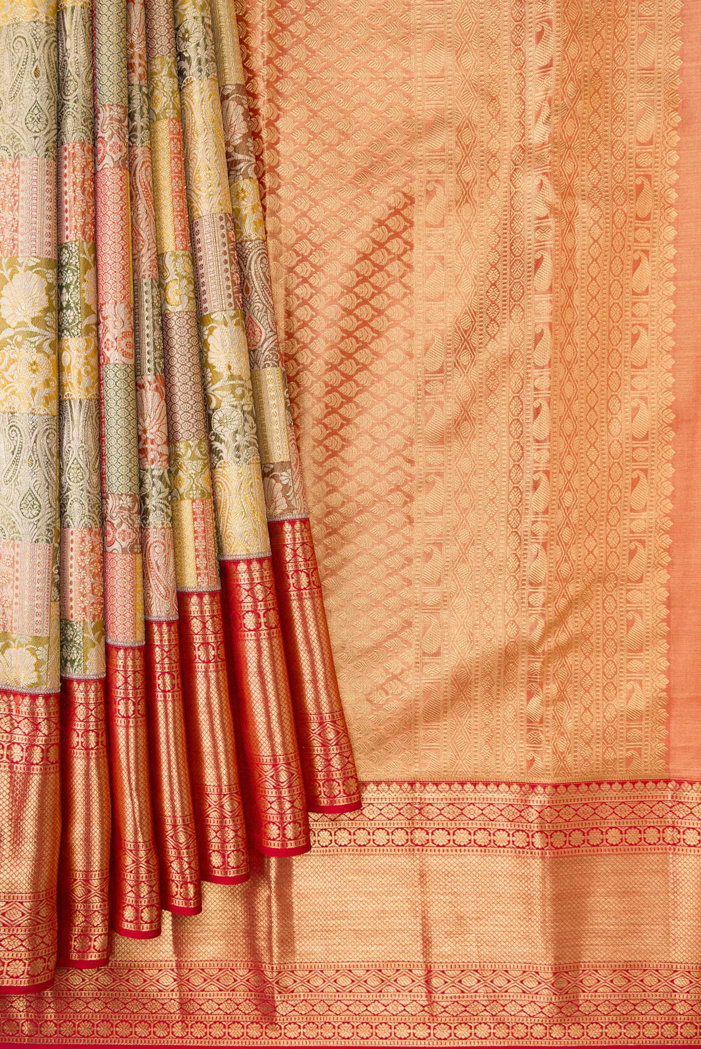 Pleats and pallu of Gold Dual Tone Kanjivaram Tissue Silk Saree with Zari Brocade on the body and Zari Border. 