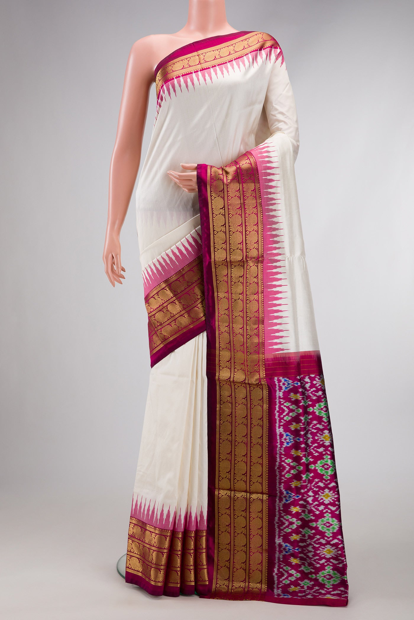 White Dual Tone Double Ikat Saree with Ikat Print on the body and Zari Border.  displayed on a mannequin