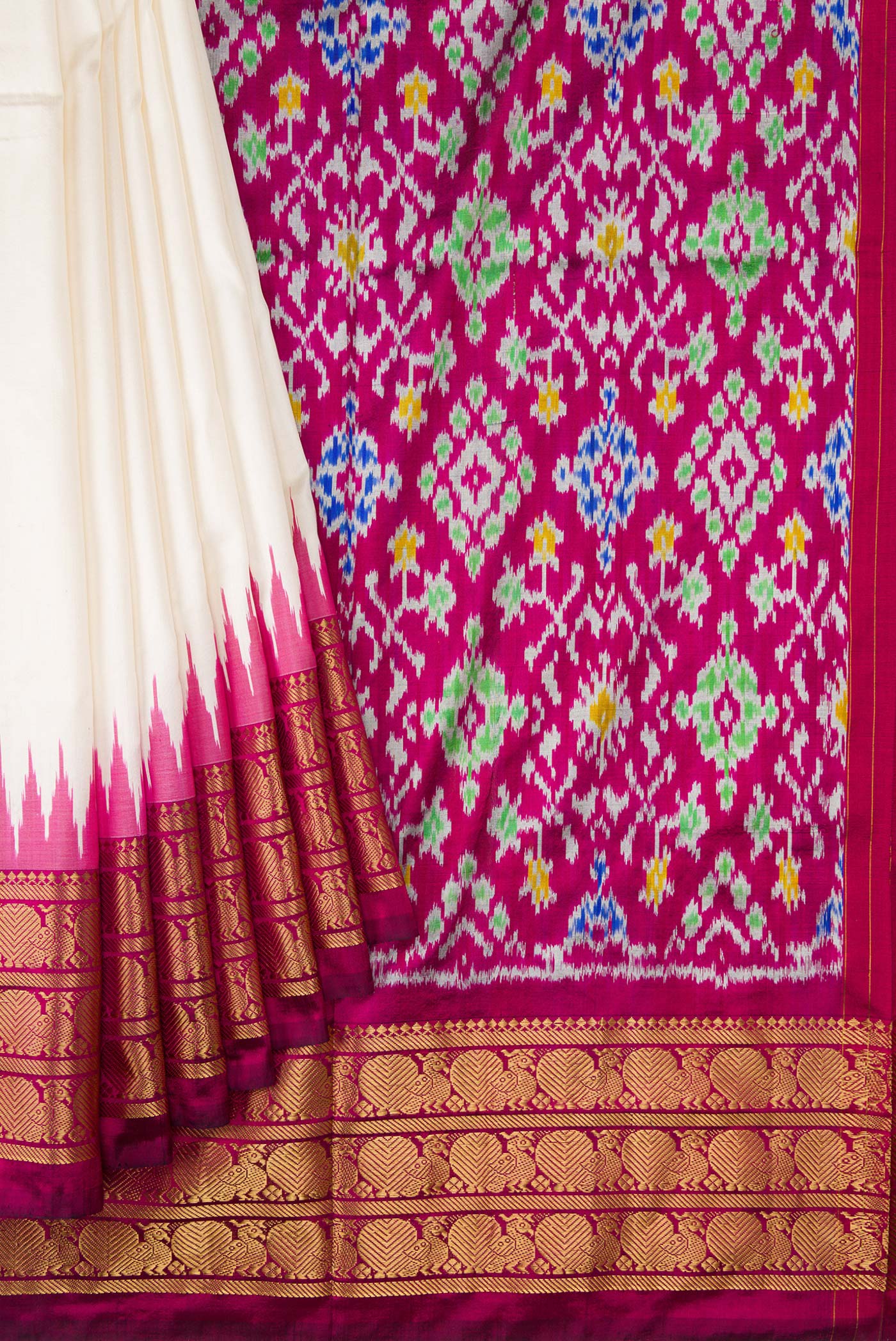 Pleats and pallu of White Dual Tone Double Ikat Saree with Ikat Print on the body and Zari Border. 