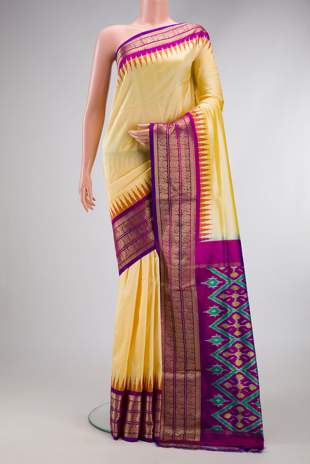 Sandal Dual Tone Double Ikat Saree with Plain Body and Zari Border.  displayed on a mannequin