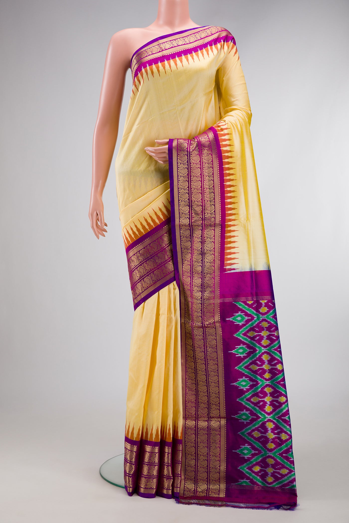 Sandal Dual Tone Double Ikat Saree with Plain Body and Zari Border.  displayed on a mannequin
