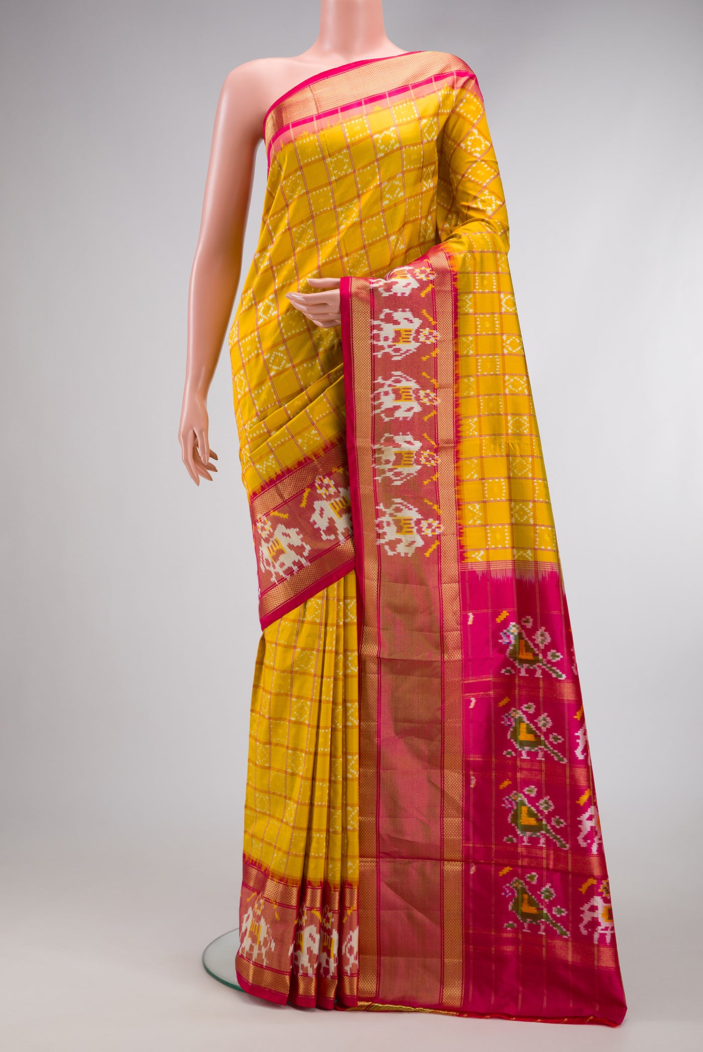 Pink Dual Tone Double Ikat Saree with Ikat Print on the body and Ikat Border.  displayed on a mannequin