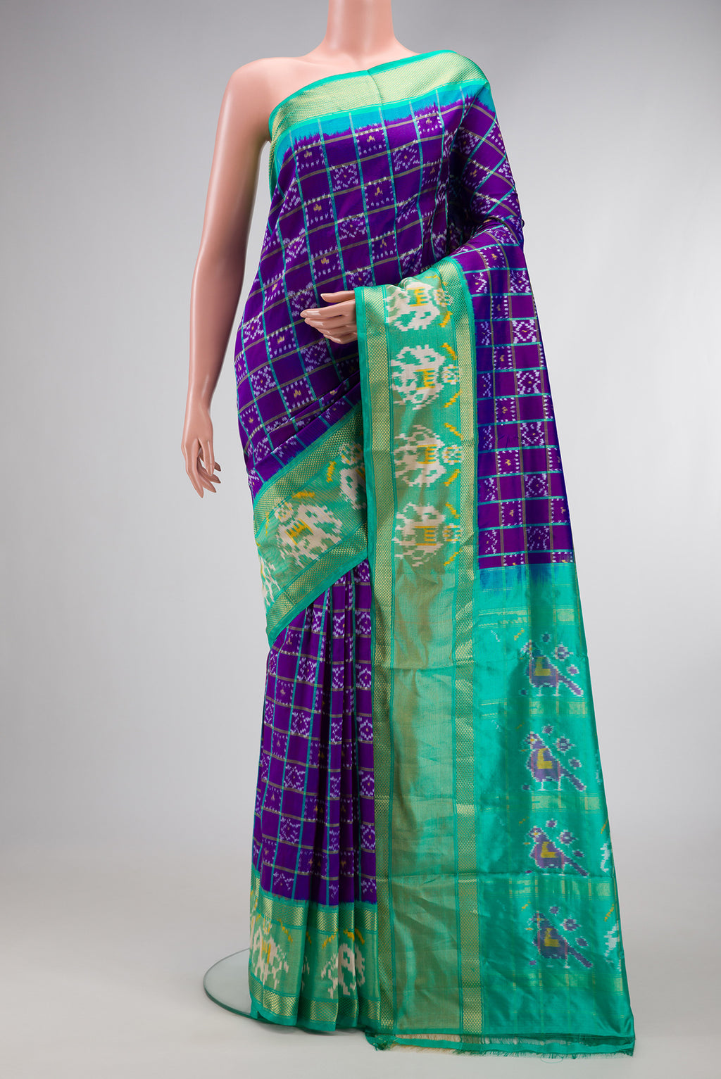 Purple Dual Tone Double Ikat Saree with Ikat Print on the body and Ikat Border.  displayed on a mannequin