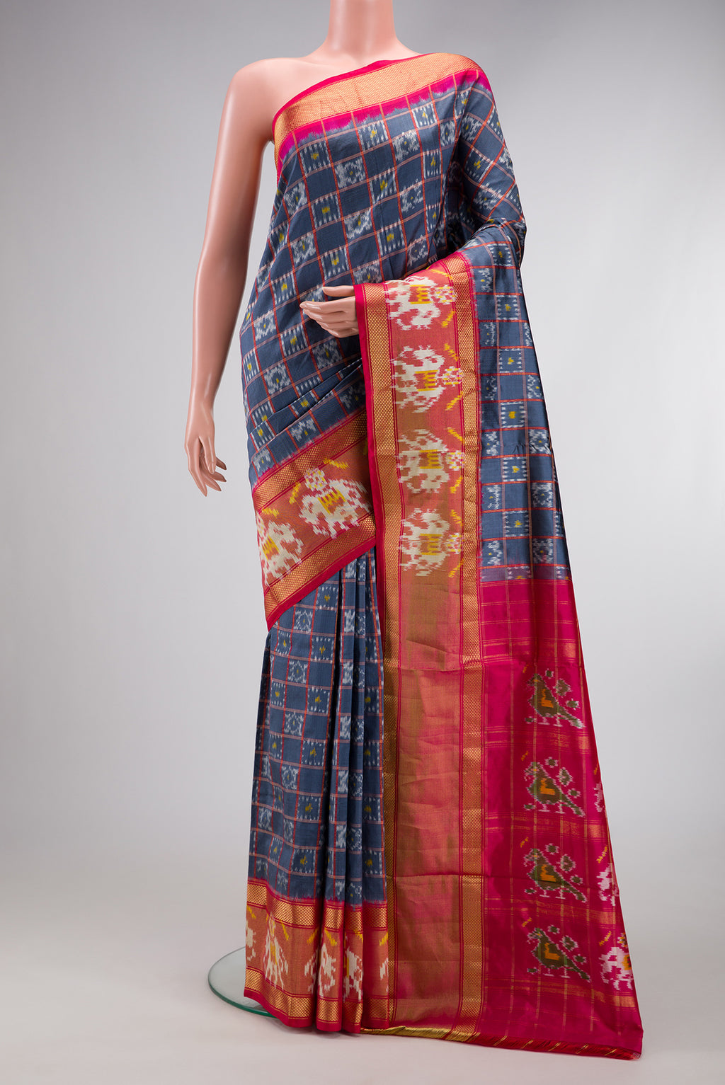 Grey Dual Tone Double Ikat Saree with Ikat Print on the body and Ikat Border.  displayed on a mannequin